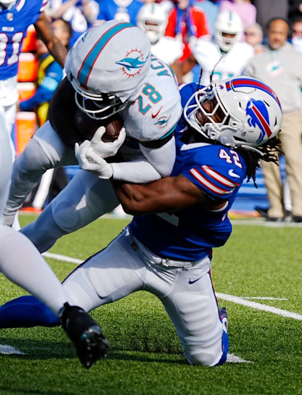 Bills Doiran Williams takes down Miami's De'Von Achane during first half action at Highmark Stadium on Nov. 3, 2024.