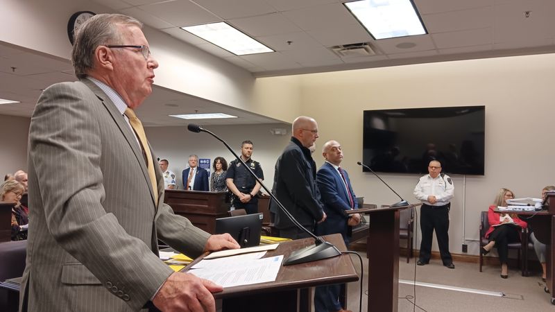 Onondoga County District Attorney William Fitzpatrick, left, stands before Judge Robert Bauer. Picture right of Fitzpatrick is Nicholas Anzalone, left, and his attorney.