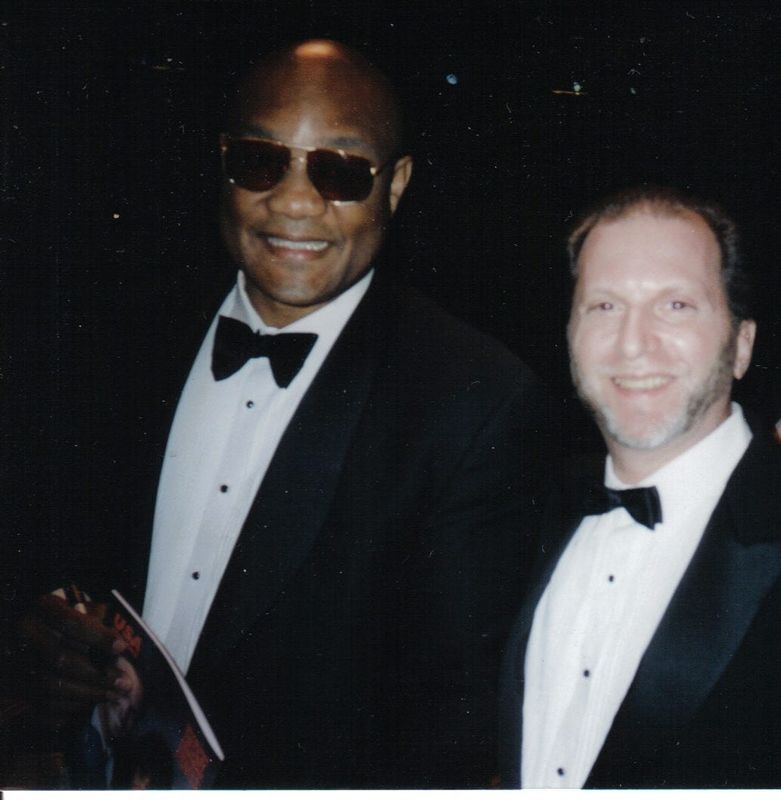 George Foreman poses alongside Ron Lipton, a former boxing referee, during an awards ceremony in April 1995.