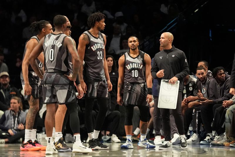 Apr 3, 2025; Brooklyn, New York, USA; Brooklyn Nets head coach Jordi Fernandez speaks to his players at a break in the action during the first half against the Minnesota Timberwolves at Barclays Center. Mandatory Credit: Gregory Fisher-Imagn Images