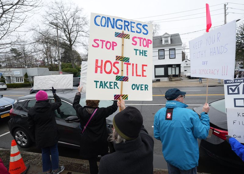 Hundreds of demonstrators protested President Donald Trump and Elon Musk at a Hands Off! rally at Harbor Island Park in Mamaroneck on Saturday, April 5, 2025.