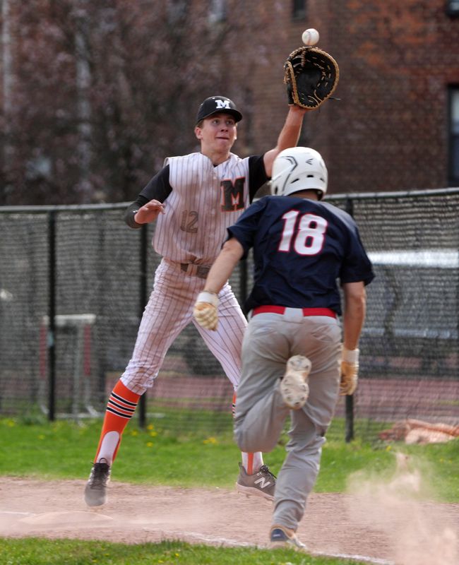 Mamaroneck's Graham Williams jumps for throw to nab Ketcham's Evan Kelly during Mamaroneck's 10-9 walk-off win at Mamaroneck High School April 22, 2025.