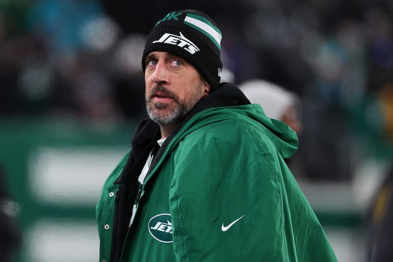 Jan 5, 2025; East Rutherford, New Jersey, USA; New York Jets quarterback Aaron Rodgers (8) during the third quarter of their game against the Miami Dolphins at MetLife Stadium. Mandatory Credit: Ed Mulholland-Imagn Images