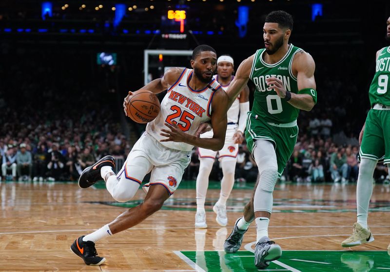 May 7, 2025; Boston, Massachusetts, USA; New York Knicks forward Mikal Bridges (25) drives the ball against Boston Celtics forward Jayson Tatum (0) in the second quarter during game two of the second round for the 2025 NBA Playoffs at TD Garden. Mandatory Credit: David Butler II-Imagn Images