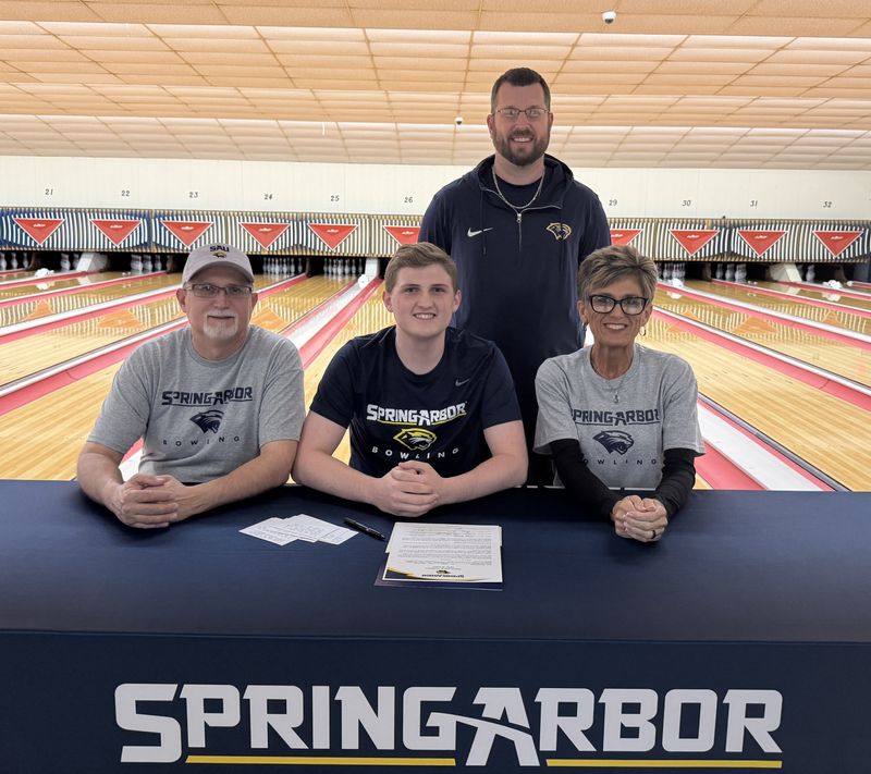 Horseheads High School senior Michael Rennells, center, signed to bowl collegiately at Spring Arbor University in Michigan during a ceremony May 13, 2025 at Crystal Lanes in Corning. Alongside Michael are his parents, Ted and Tricia Rennells, and Spring Arbor coach Gerry Lobdell.
