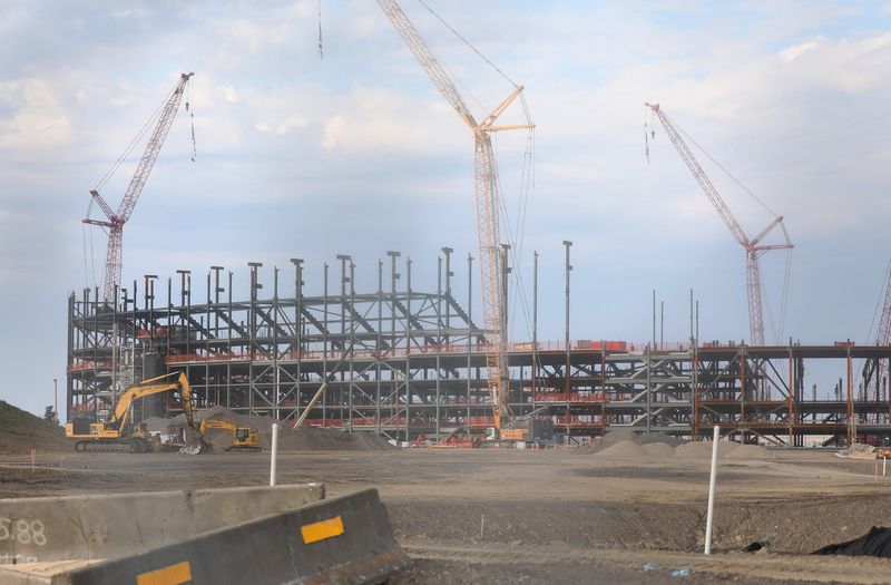 The Buffalo Bills new stadium is being built across from the current one, Highmark Stadium in Orchard Park on Aug. 24, 2024. A view of the construction through a chain link fence.