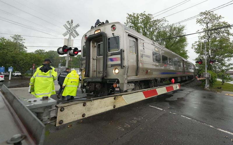 MTA Police and NJ Transit officials investigate an incident on the tracks just north of the Nanuet train station May 14, 2025.