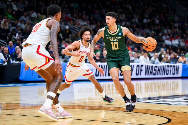 Mar 23, 2025; Seattle, WA, USA; Colorado State Rams guard Nique Clifford (10) dribbles the ball against Maryland Terrapins guard Ja'Kobi Gillespie (0) and forward Julian Reese (10) in the second half at Climate Pledge Arena. Mandatory Credit: Steven Bisig-Imagn Images