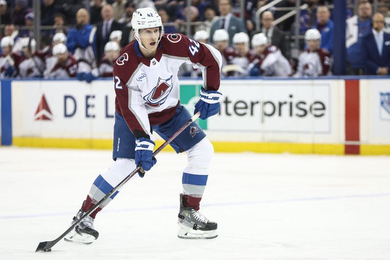 FILE PHOTO: Jan 26, 2025; New York, New York, USA;  Colorado Avalanche defenseman Josh Manson (42) controls the puck in the first period against the New York Rangers at Madison Square Garden. Mandatory Credit: Wendell Cruz-Imagn Images/File Photo