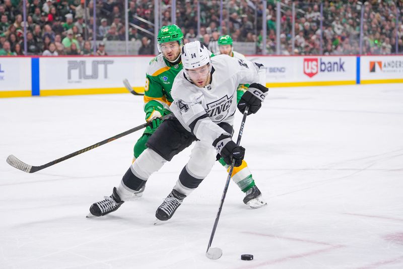 Mar 17, 2025; Saint Paul, Minnesota, USA;  Los Angeles Kings right wing Alex Laferriere (14) skates with the puck against the Minnesota Wild in the third period at Xcel Energy Center. Mandatory Credit: Brad Rempel-Imagn Images/ File Photo