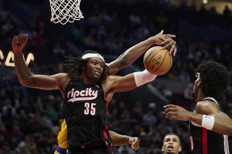 Feb 20, 2025; Portland, Oregon, USA; Portland Trail Blazers center Robert Williams III (35) grabs a rebound during the second half against the Los Angeles Lakers at Moda Center. Mandatory Credit: Troy Wayrynen-Imagn Images/File Photo