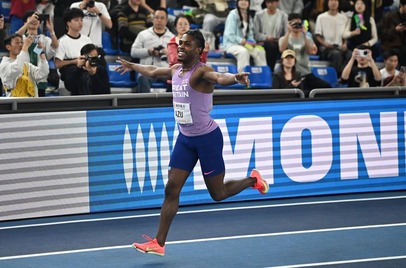 Athletics - World Athletics Indoor Championships - Nanjing Youth Olympic Sports Park, Nanjing, China - March 21, 2025 Britain's Jeremiah Azu celebrates winning the Men's 60m Final REUTERS/Dylan Martinez