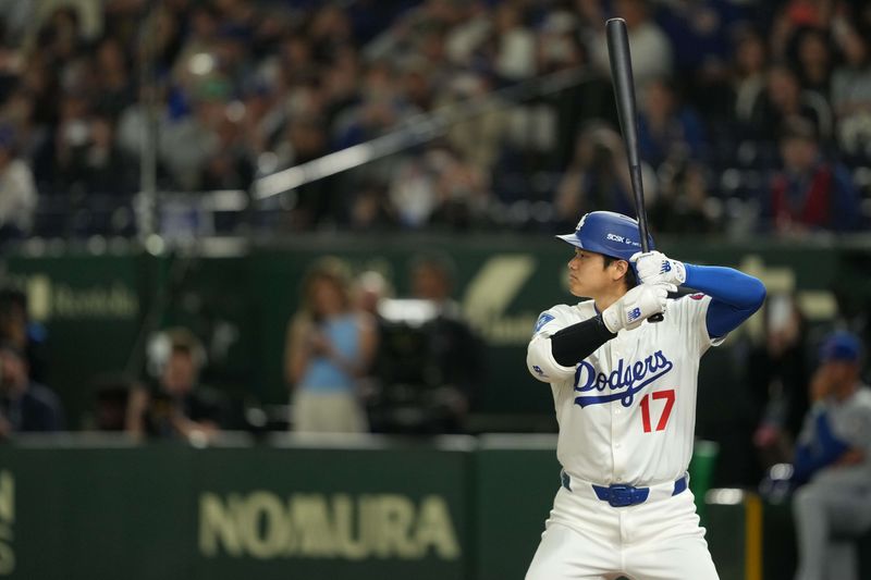 Mar 19, 2025; Bunkyo, Tokyo, JPN; Los Angeles Dodgers designated hitter Shohei Ohtani (17) taking an at-bat during the ninth inning against the Chicago Cubs during the Tokyo Series at Tokyo Dome. Mandatory Credit: Darren Yamashita-Imagn Images/ File Photo