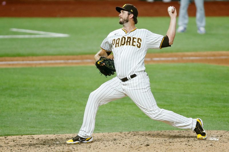 FILE PHOTO: Oct 8, 2020; Arlington, Texas, USA; San Diego Padres relief pitcher Drew Pomeranz (15) pitches against the Los Angeles Dodgers during the eighth inning during game three of the 2020 NLDS at Globe Life Field. The Los Angeles Dodgers won 12-3 to sweep the San Diego Padres. Mandatory Credit: Tim Heitman-USA TODAY Sports/File Photo