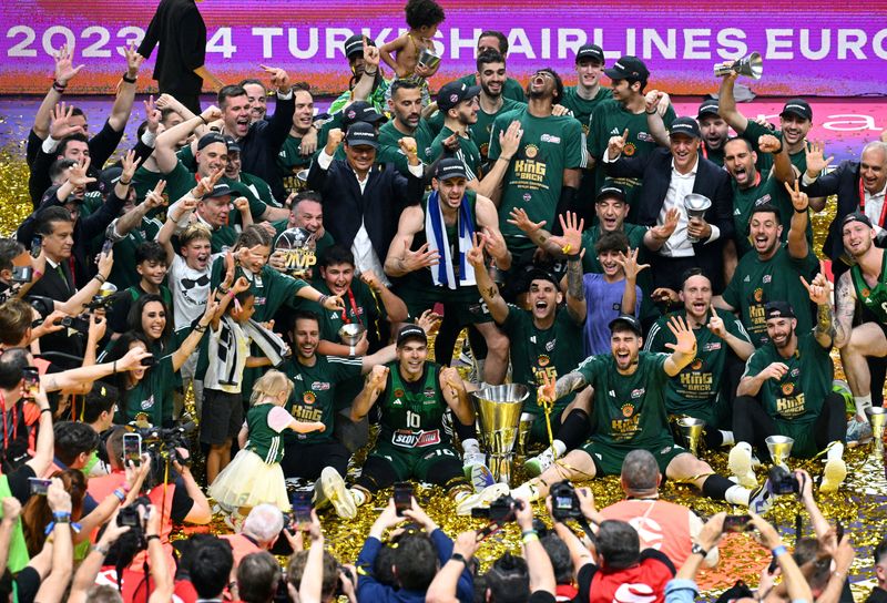 FILE PHOTO: Basketball - EuroLeague - Final - Real Madrid v Panathinaikos BC - Uber Arena, Berlin, Germany - May 26, 2024 Panathinaikos BC players celebrate with the trophy after winning the EuroLeague REUTERS/Annegret Hilse/File Photo