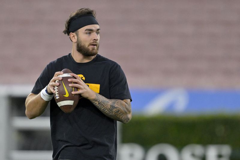 FILE PHOTO: Nov 8, 2024; Pasadena, California, USA;  Iowa Hawkeyes quarterback Brendan Sullivan (1) warms up prior to the game against the UCLA Bruins at the Rose Bowl. Mandatory Credit: Jayne Kamin-Oncea-Imagn Images/File Photo