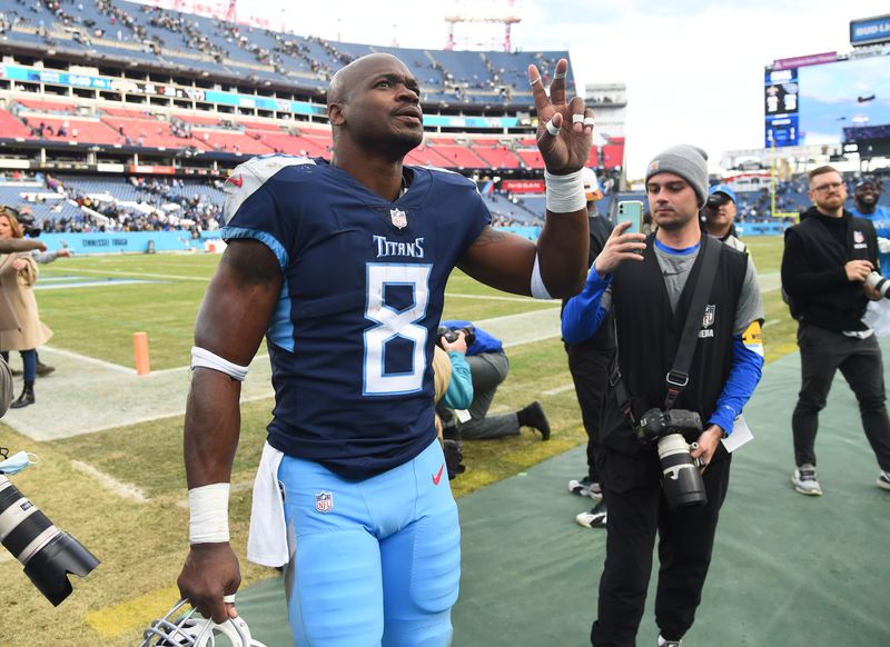 FILE PHOTO: Nov 14, 2021; Nashville, Tennessee, USA; Tennessee Titans running back Adrian Peterson (8) leaves the field after a win against the New Orleans Saints at Nissan Stadium. Mandatory Credit: Christopher Hanewinckel-USA TODAY Sports/File Photo