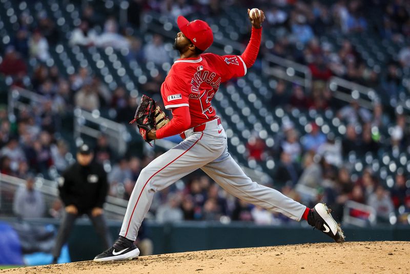 Apr 25, 2025; Minneapolis, Minnesota, USA; Los Angeles Angels pitcher Carl Edwards Jr. (52) delivers a pitch against the Minnesota Twins during the fourth inning at Target Field. Mandatory Credit: Matt Krohn-Imagn Images/File Photo