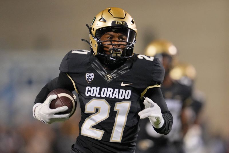 Sep 16, 2023; Boulder, Colorado, USA; Colorado Buffaloes safety Shilo Sanders (21) runs for a touchdown after making an interception against the Colorado State Rams during the first half at Folsom Field. Mandatory Credit: Andrew Wevers-USA TODAY Sports/File Photo