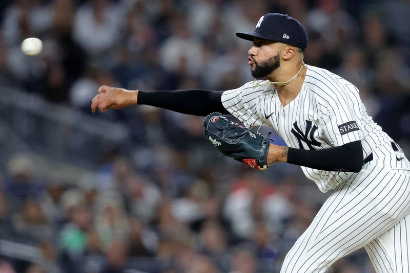 FILE PHOTO: Apr 25, 2025; Bronx, New York, USA; New York Yankees relief pitcher Devin Williams (38) pitches against the Toronto Blue Jays during the ninth inning at Yankee Stadium. Mandatory Credit: Brad Penner-Imagn Images/File Photo
