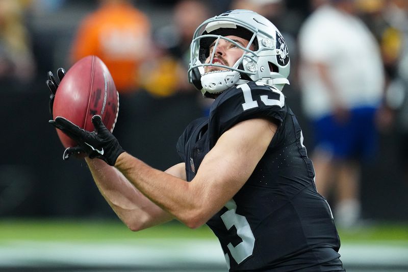 FILE PHOTO: Sep 24, 2023; Paradise, Nevada, USA; Las Vegas Raiders wide receiver Hunter Renfrow (13) warms up before a game against the Pittsburgh Steelers at Allegiant Stadium. Mandatory Credit: Stephen R. Sylvanie-USA TODAY Sports/File Photo