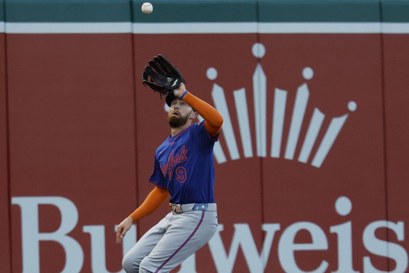 Apr 28, 2025; Washington, District of Columbia, USA; New York Mets outfielder Brandon Nimmo (9) catches a fly ball by Washington Nationals outfielder James Wood (not pictured) during the eighth inning at Nationals Park. Mandatory Credit: Geoff Burke-Imagn Images