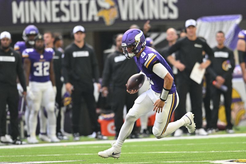 FILE PHOTO: Aug 10, 2024; Minneapolis, Minnesota, USA; Minnesota Vikings quarterback J.J. McCarthy (9) runs the ball during the second quarter against the Las Vegas Raiders at U.S. Bank Stadium. Mandatory Credit: Jeffrey Becker-USA TODAY Sports/File Photo