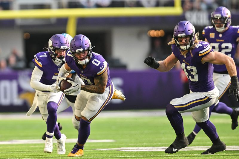 FILE PHOTO: Oct 20, 2024; Minneapolis, Minnesota, USA; Minnesota Vikings linebacker Ivan Pace Jr. (0) returns a fumble 36 yards for a touchdown as linebacker Andrew Van Ginkel (43) and cornerback Byron Murphy Jr. (7) look to block against the Detroit Lions during the fourth quarter at U.S. Bank Stadium. Mandatory Credit: Jeffrey Becker-Imagn Images/File Photo