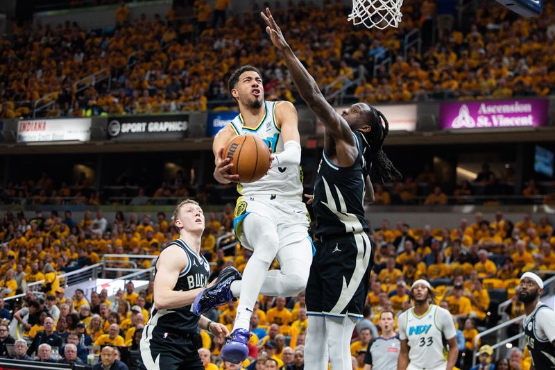 Apr 29, 2025; Indianapolis, Indiana, USA; Indiana Pacers guard Tyrese Haliburton (0) shoots the ball while Milwaukee Bucks forward Taurean Prince (12) defends during game five of the first round for the 2024 NBA Playoffs at Gainbridge Fieldhouse. Mandatory Credit: Trevor Ruszkowski-Imagn Images