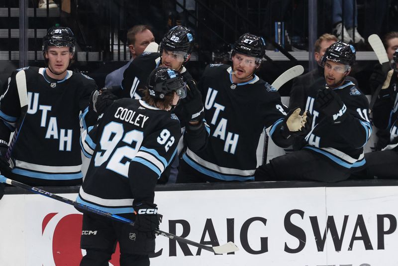 FILE PHOTO: Feb 23, 2025; Salt Lake City, Utah, USA; Utah Hockey Club center Logan Cooley (92) celebrates a goal with players on the bench during the second period against the Vancouver Canucks at Delta Center. Mandatory Credit: Rob Gray-Imagn Images/File Photo