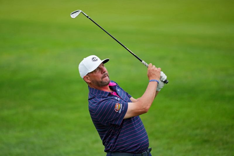FILE PHOTO: May 15, 2024; Louisville, Kentucky, USA; Michael Block takes a shot on the 10th hole during a practice round for the PGA Championship golf tournament at Valhalla Golf Club. Mandatory Credit: Aaron Doster-USA TODAY Sports/File Photo