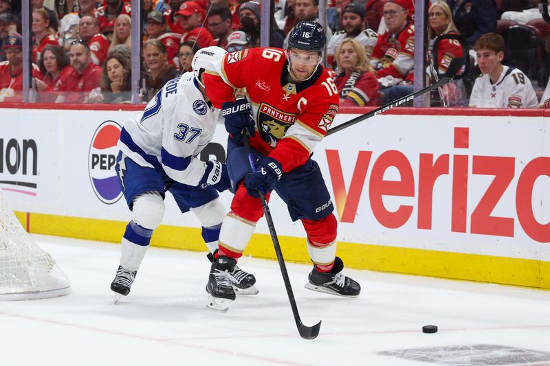 FILE PHOTO: Apr 26, 2025; Sunrise, Florida, USA; Florida Panthers center Aleksander Barkov (16) controls the puck against the Tampa Bay Lightning in the first period during game three of the first round of the 2025 Stanley Cup Playoffs at Amerant Bank Arena. Mandatory Credit: Nathan Ray Seebeck-Imagn Images/File Photo