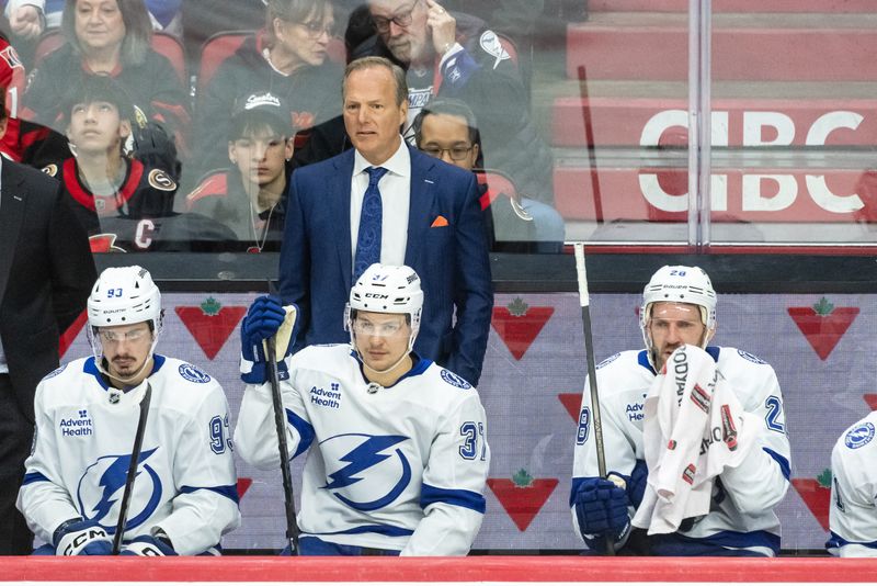 FILE PHOTO: Apr 3, 2025; Ottawa, Ontario, CAN; Tampa Bay Lightning Head coach Jon Cooper follows the action in the third period against the  Ottawa Senators at the Canadian Tire Centre. Mandatory Credit: Marc DesRosiers-Imagn Images/File Photo