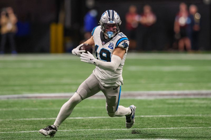 FILE PHOTO: Jan 5, 2025; Atlanta, Georgia, USA; Carolina Panthers wide receiver Adam Thielen (19) runs after a catch against the Atlanta Falcons in overtime at Mercedes-Benz Stadium. Mandatory Credit: Brett Davis-Imagn Images/File Photo