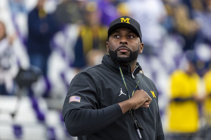 FILE PHOTO: Oct 5, 2024; Seattle, Washington, USA; Michigan Wolverines head coach Sherrone Moore walks out of the locker room during pregame warmups against the Washington Huskies at Alaska Airlines Field at Husky Stadium. Joe Nicholson-Imagn Images/ File Photo