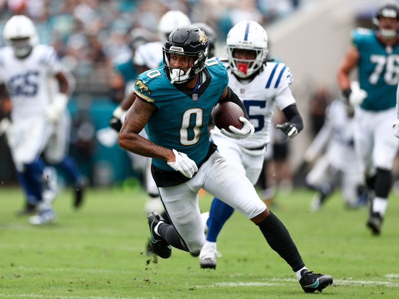 FILE PHOTO: Oct 6, 2024; Jacksonville, Florida, USA; Jacksonville Jaguars wide receiver Gabe Davis (0) runs with the ball against the Indianapolis Colts in the second quarter at EverBank Stadium. Nathan Ray Seebeck-Imagn Images/ File Photo