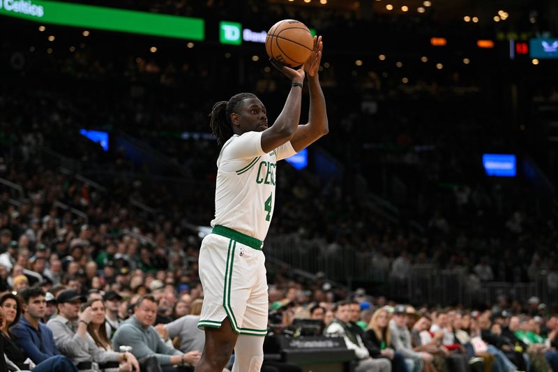 FILE PHOTO: Apr 11, 2025; Boston, Massachusetts, USA; Boston Celtics guard Jrue Holiday (4) shoots the ball against the Charlotte Hornets in the first half at TD Garden. Mandatory Credit: Eric Canha-Imagn Images/File Photo