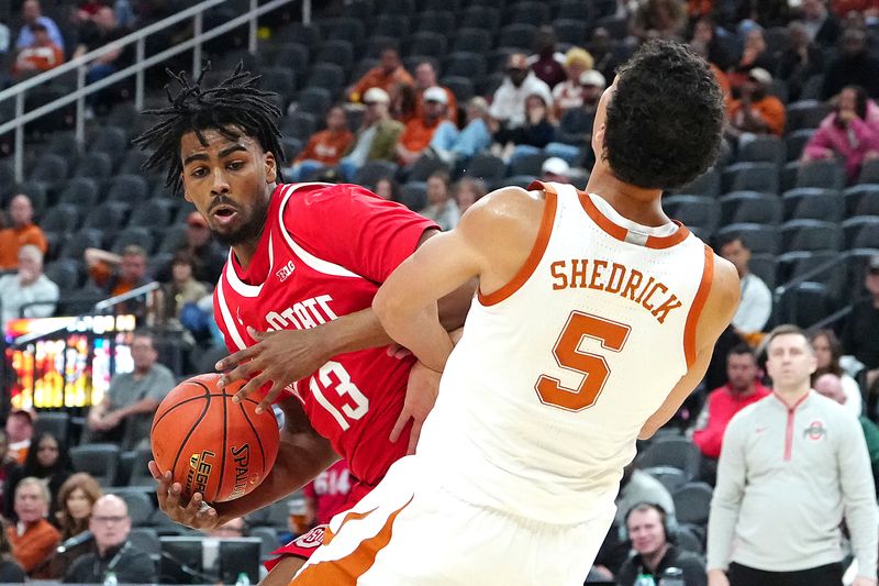 FILE PHOTO: Nov 4, 2024; Las Vegas, Nevada, USA; Ohio State Buckeyes forward Sean Stewart (13) fouls Texas Longhorns forward Kadin Shedrick (5) during the second half at T-Mobile Arena. Mandatory Credit: Stephen R. Sylvanie-Imagn Images/File Photo