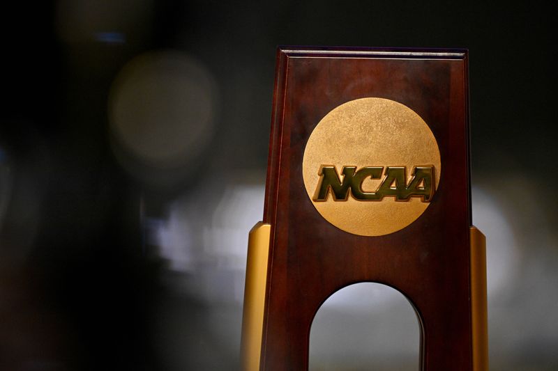 FILE PHOTO: Apr 19, 2025; Fort Worth, TX, USA; A view of the NCAA logo and trophy before the 2025 Women's National Gymnastics Championship at Dickies Arena. Mandatory Credit: Jerome Miron-Imagn Images/File Photo