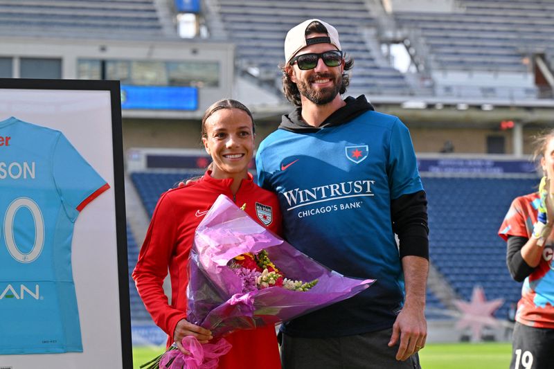 FILE PHOTO; Oct 12, 2024; Bridgeview, Illinois, USA; Chicago Red Stars forward Mallory Swanson (9) with her husband Dansby Swanson as she is honored for her 100th cap before the game between the Chicago Red Stars and NJ/NY Gotham FC at SeatGeek Stadium. Daniel Bartel-Imagn Images/ File Photo