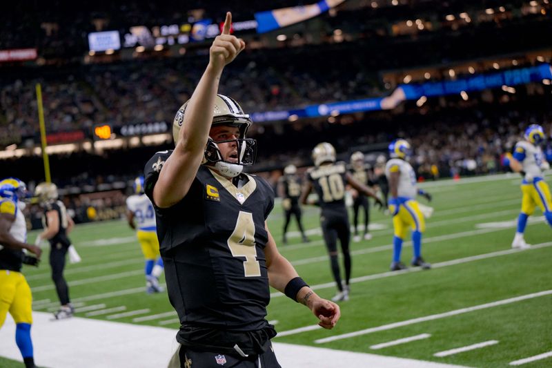 FILE PHOTO: Dec 1, 2024; New Orleans, Louisiana, USA; New Orleans Saints quarterback Derek Carr (4) reacts after rushing for a first down against the Los Angeles Rams during the fourth quarter at Caesars Superdome. Mandatory Credit: Matthew Hinton-Imagn Images/File Photo