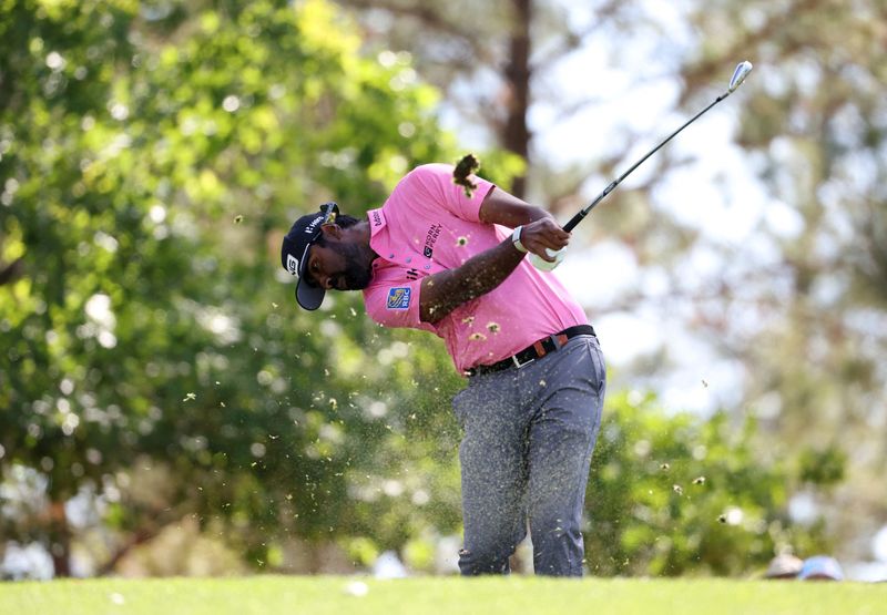 FILE PHOTO: Golf - The Masters - Augusta National Golf Club, Augusta, Georgia, U.S. - April 11, 2025 Sahith Theegala of the U.S. hits his tee shot on the 4th hole during the second round REUTERS/Pilar Olivares/File Photo