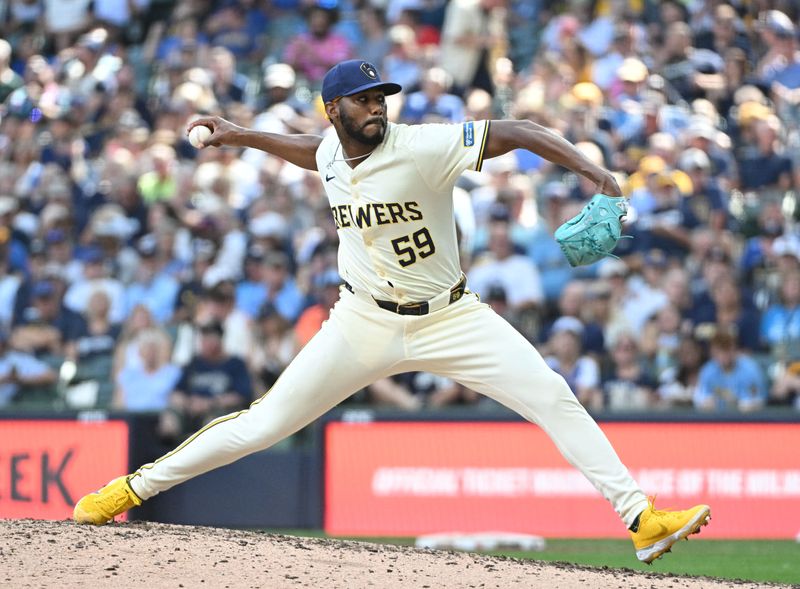 FILE PHOTO: Jul 31, 2024; Milwaukee, Wisconsin, USA; Milwaukee Brewers pitcher Elvis Peguero (59) delivers against the Atlanta Braves in the sixth inning at American Family Field. Mandatory Credit: Michael McLoone-USA TODAY Sports/File Photo