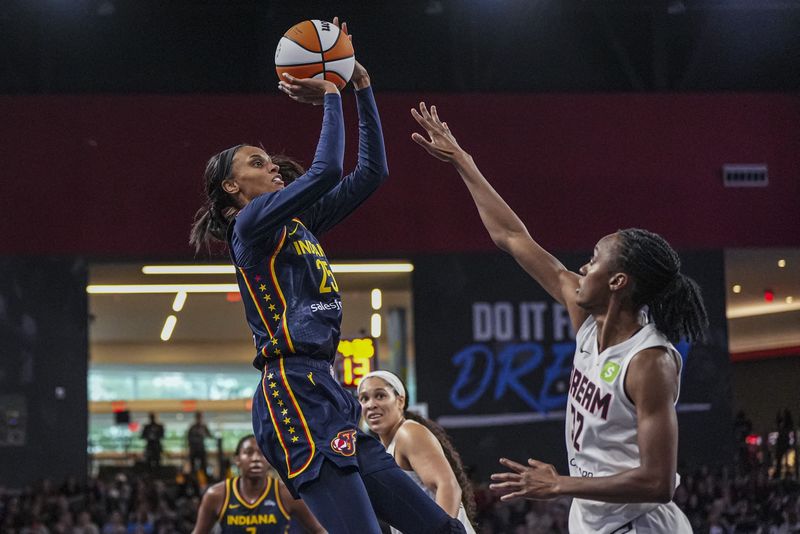 FILE PHOTO: May 10, 2025; Atlanta, GA, USA; Indiana Fever forward DeWanna Bonner (25) shoots over Atlanta Dream guard Shatori Walker-Kimbrough (32) during the second half at Gateway Center Arena @ College Park. Mandatory Credit: Dale Zanine-Imagn Images/File Photo