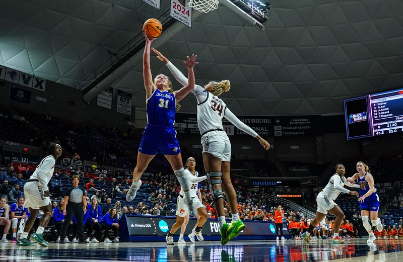 Mar 22, 2025; Storrs, Connecticut, USA; South Dakota State Jackrabbits forward Brooklyn Meyer (31) shoots the ball against Oklahoma State Cowgirls center Tenin Magassa (34) in the second half at Harry A. Gampel Pavilion. David Butler II-Imagn Images