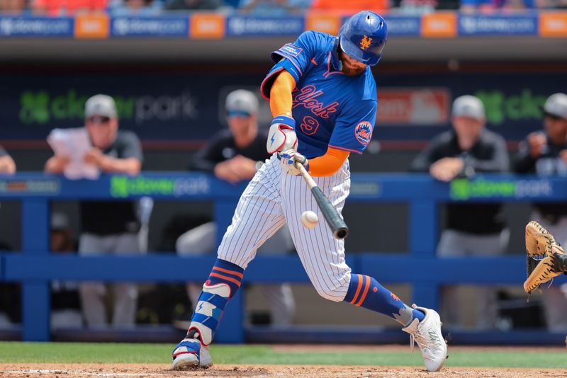 Mar 24, 2025; Port St. Lucie, Florida, USA; New York Mets left fielder Brandon Nimmo (9) hits a single against the New York Yankees during the first inning at Clover Park. Mandatory Credit: Sam Navarro-Imagn Images