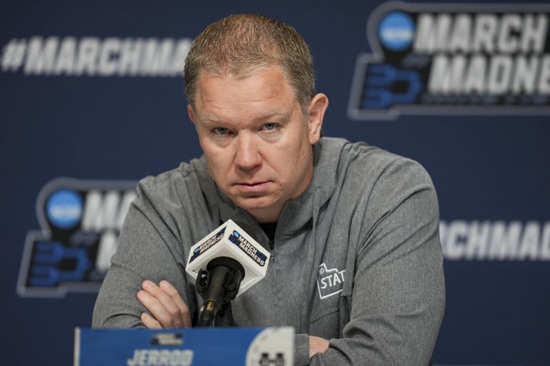 FILE PHOTO: Mar 19, 2025; Lexington, KY, USA;  Utah State head coach Jerrod Calhoun talks with media during NCAA Tournament First Round Practice at Rupp Arena. Mandatory Credit: Aaron Doster-Imagn Images/File Photo