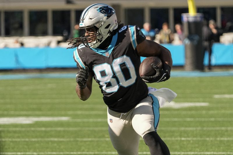 FILE PHOTO: Dec 24, 2022; Charlotte, North Carolina, USA; Carolina Panthers tight end Ian Thomas (80) runs after a catch around end during the second quarter against the Detroit Lions at Bank of America Stadium. Mandatory Credit: Jim Dedmon-USA TODAY Sports/File Photo