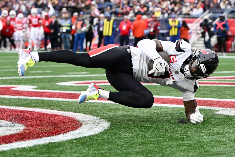 FILE PHOTO: Oct 13, 2024; Foxborough, Massachusetts, USA; Houston Texans wide receiver Stefon Diggs (1) makes a catch for a touchdown against the New England Patriots during the second half at Gillette Stadium. Mandatory Credit: Brian Fluharty-Imagn Images/File Photo
