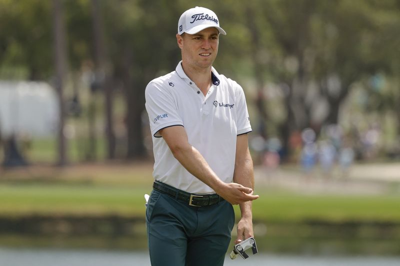 Mar 23, 2025; Palm Harbor, Florida, USA;  Justin Thomas motions for his putt to turn on the second green during the final round of the Valspar Championship golf tournament at Innisbrook Resort. Mandatory Credit: Reinhold Matay-Imagn Images/File Photo